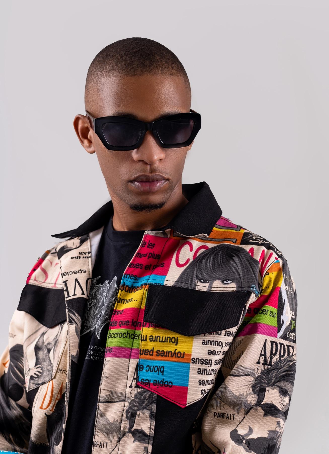 Argento Dust in sunglasses and printed jacket, studio portrait